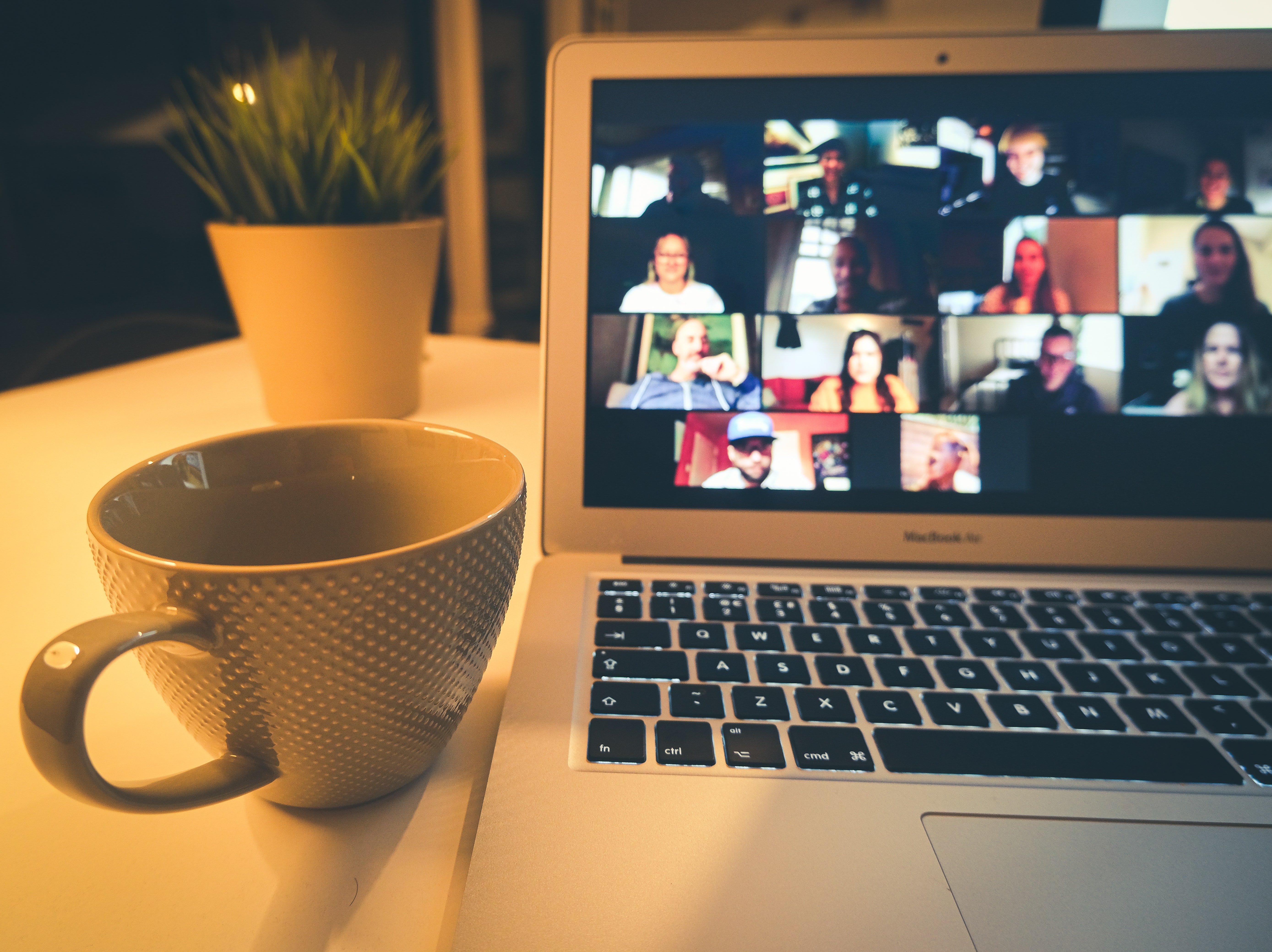 coffee cup next to laptop